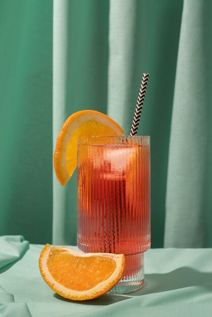 Blend of cocktails in glass with orange fruit