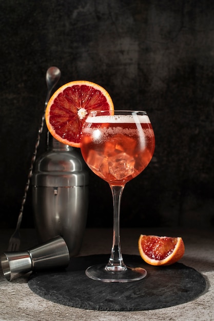 Blend of cocktails in glasses with ice cubes and blood orange