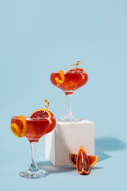 Blend of cocktails in glasses with ice cubes and blood orange