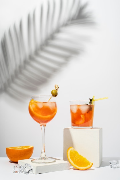 Blend of cocktails in glasses with orange fruit