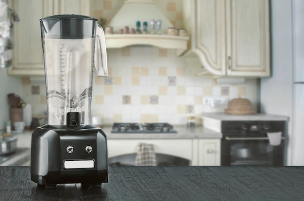 Blender and wooden table in kitchen. Do Smoothies