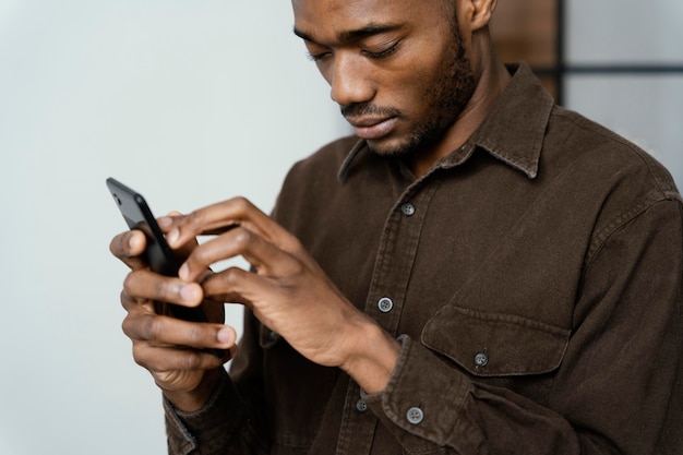 Blind man with smartphone close up