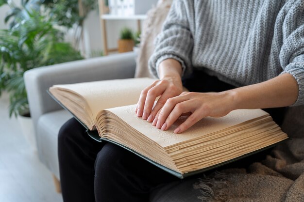 Blind person reading at home