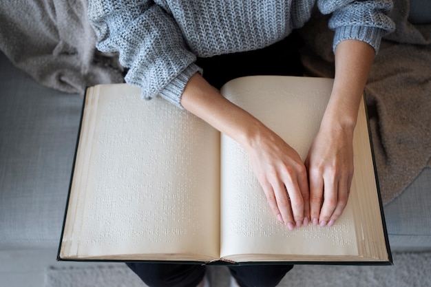 Blind person reading at home