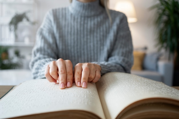 Blind person reading at home