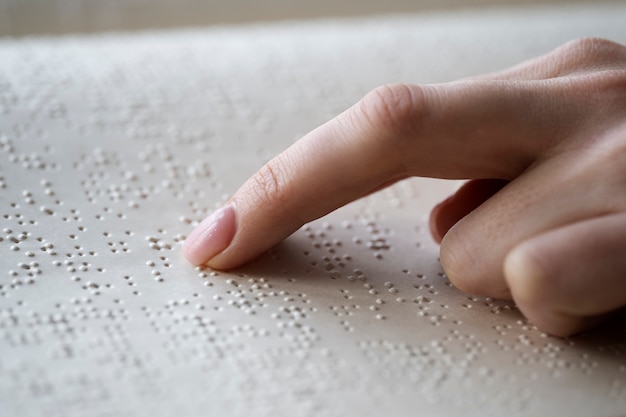 Blind person reading at home