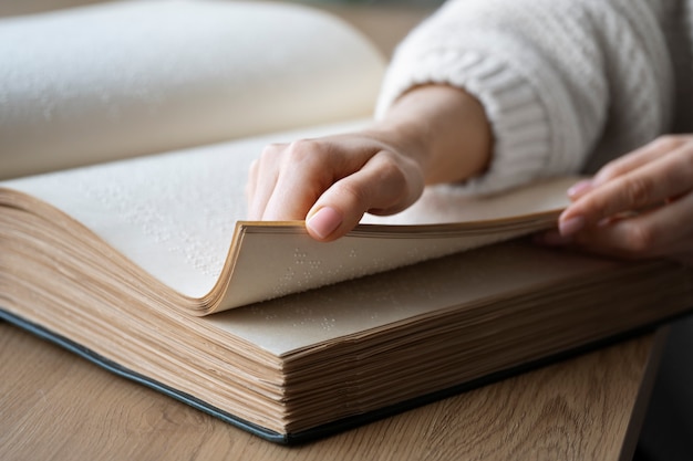 Blind person reading at home