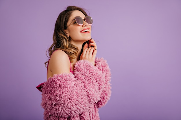 Free photo blissful white woman posing in sunglasses