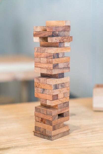 blocks wood game (jenga) on wooden table