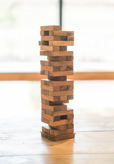 blocks wood game (jenga) on wooden table