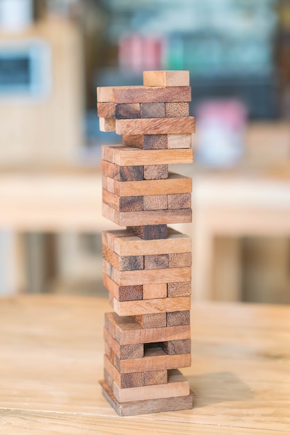 blocks wood game (jenga) on wooden table