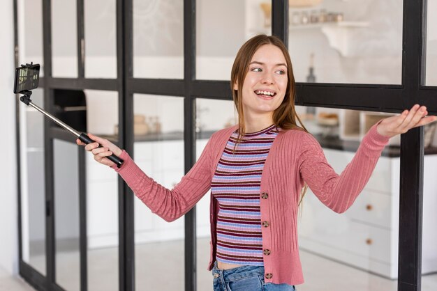 Blogger showing her house using selfie stick