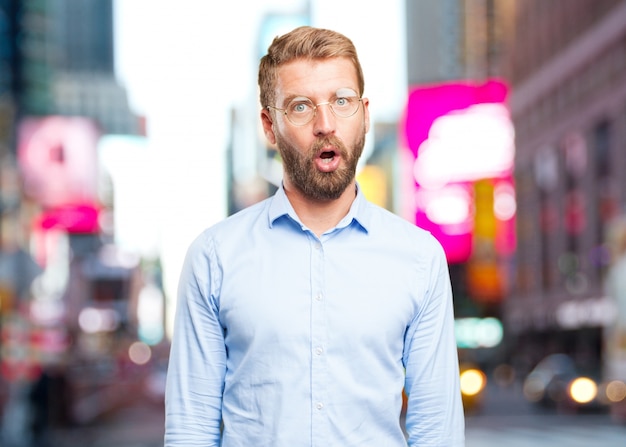 Free photo blond businessman surprised expression