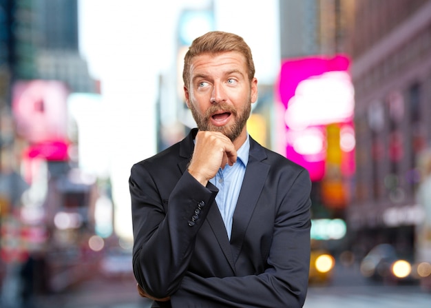 Free Photo blond businessman surprised expression