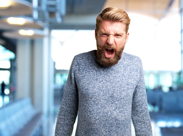 Free photo blond man angry expression