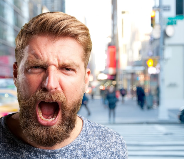 Free photo blond man angry expression