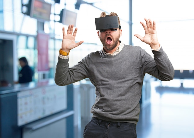 blond man with virtual glasses. surprised expression