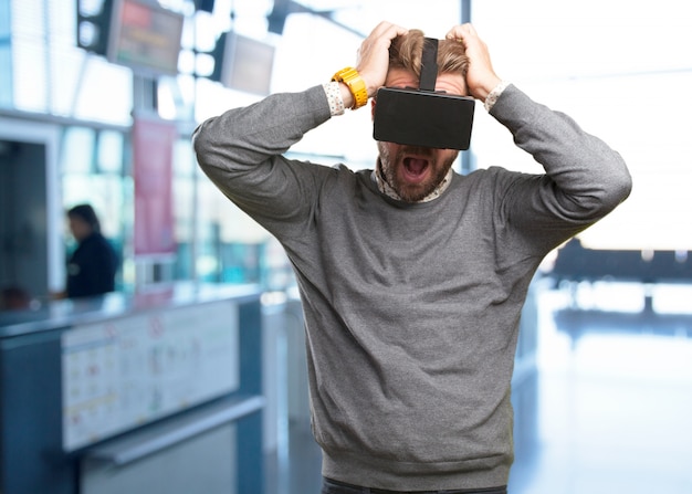 blond man with virtual glasses. surprised expression