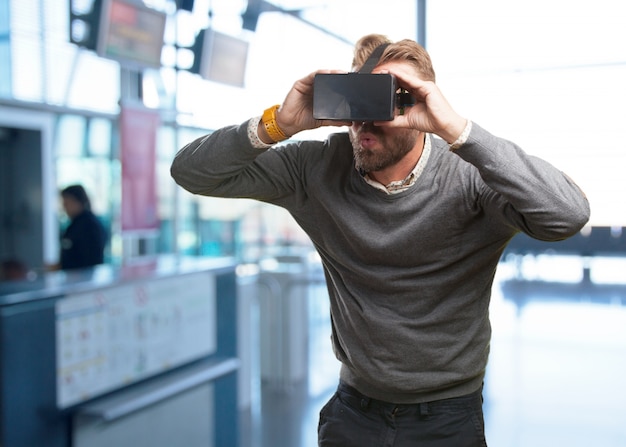 Free photo blond man with virtual glasses. surprised expression