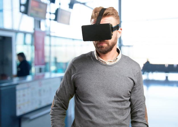 Free photo blond man with virtual glasses. surprised expression