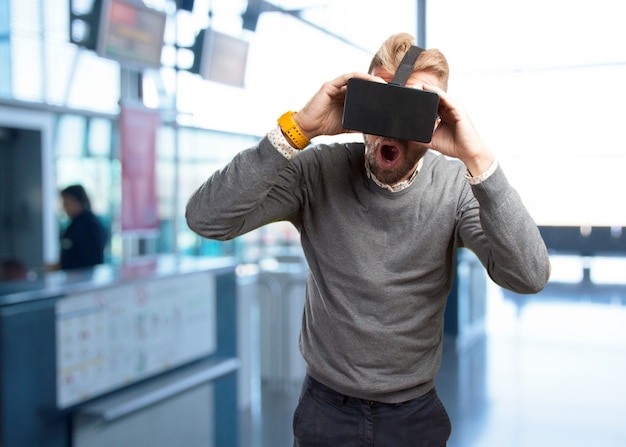 blond man with virtual glasses. surprised expression