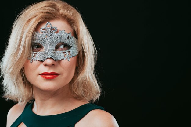 Free Photo blond woman in grey carnival mask