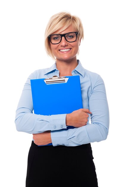 Blonde and beautiful businesswoman holding blue clipboard