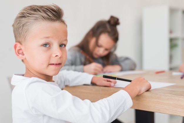 Blonde boy painting