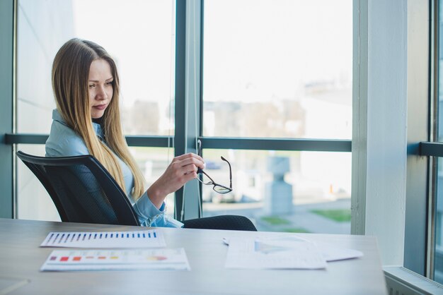 Blonde businesswoman on a chair