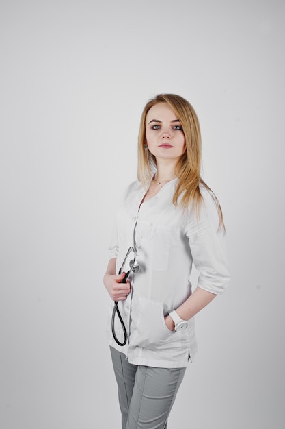 Blonde doctor nurse with stethoscope isolated on white background