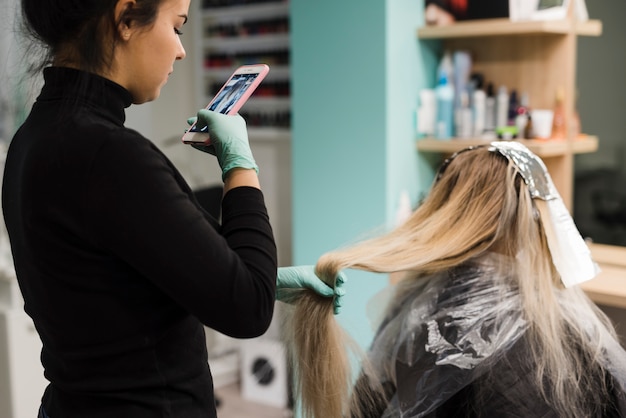 Blonde girl getting her hair done