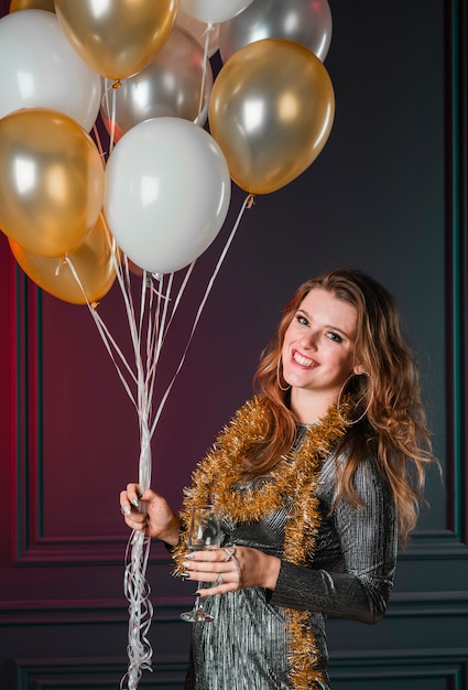 Blonde girl holding balloons