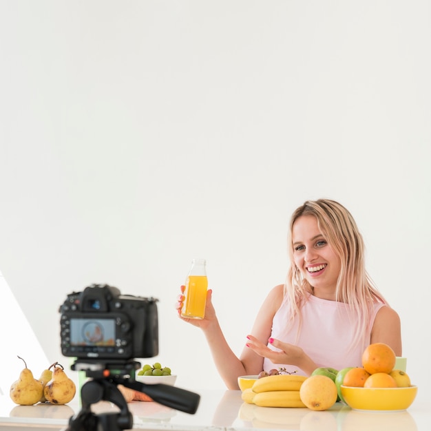 Blonde influencer recording nutrition food