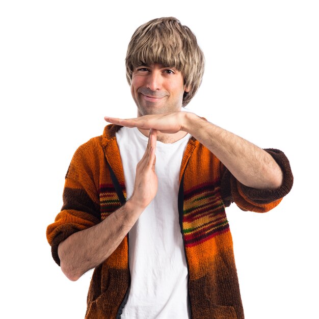 Blonde man making time out gesture