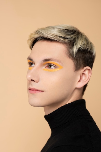 Blonde man wearing make-up