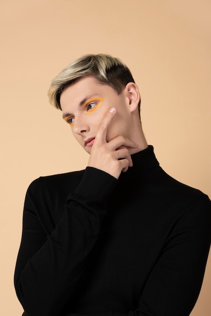 Free photo blonde man wearing make-up