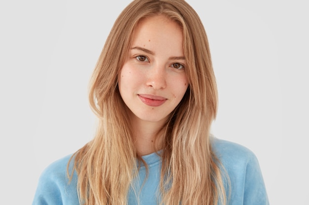 Free Photo blonde woman in blue shirt posing