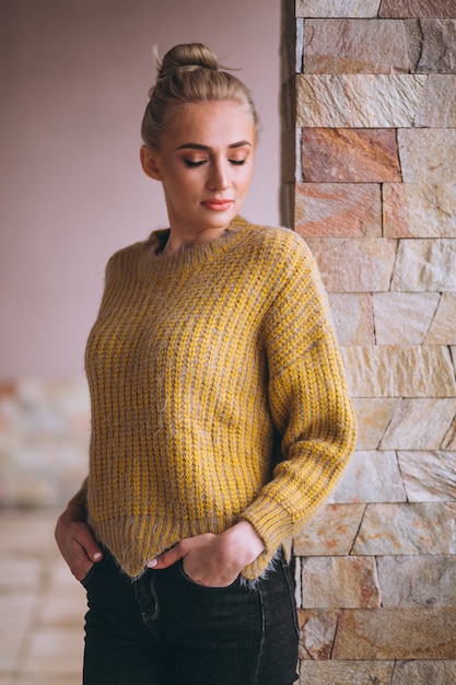 Free Photo blonde woman in cool yellow sweater