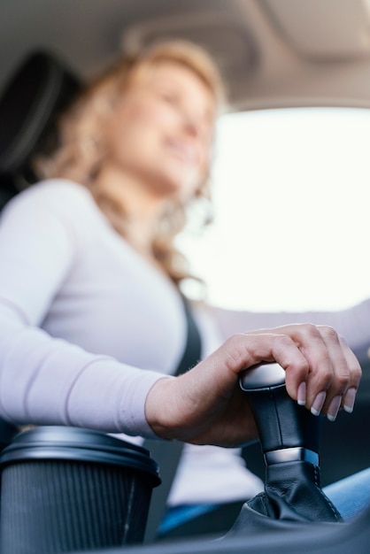 Blonde woman driving her car