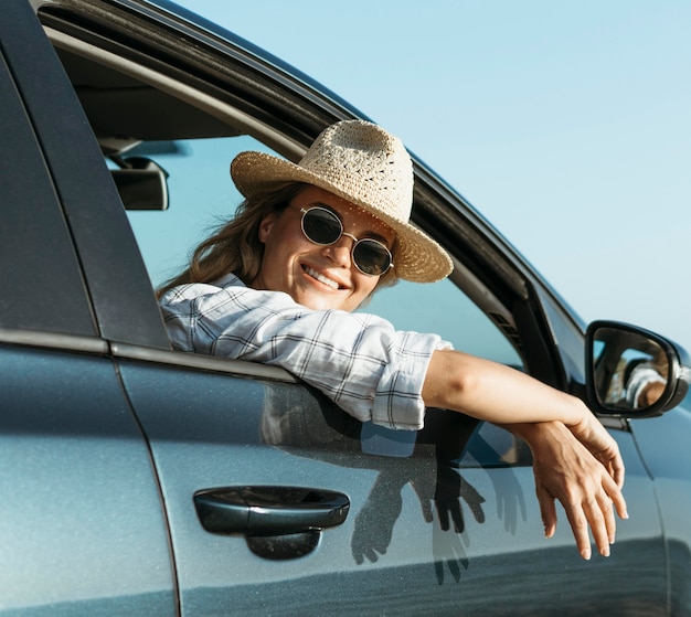 Blonde woman looking out of car window