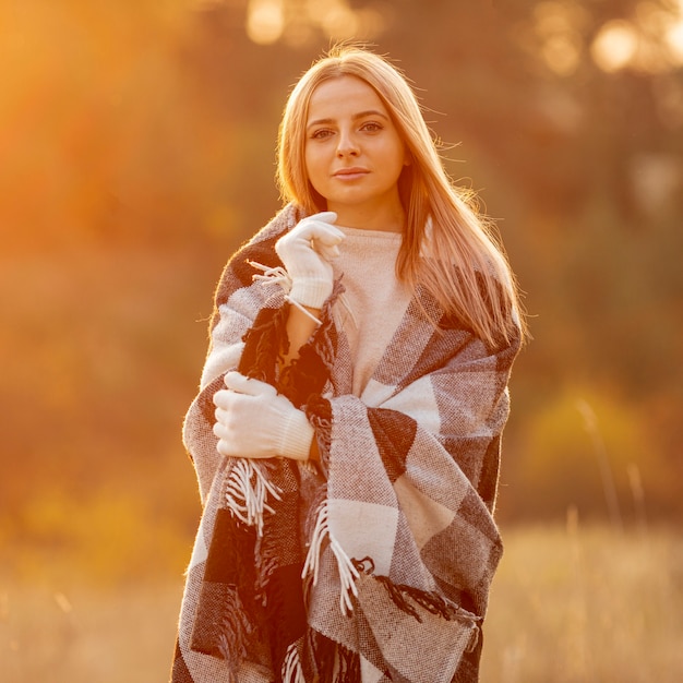 Blonde woman staying outside