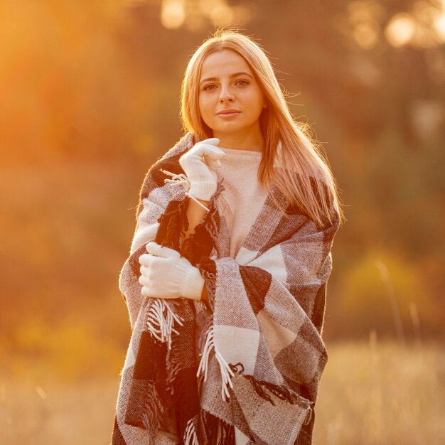 Blonde woman staying outside