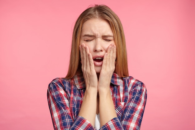 Blonde woman in striped shirt