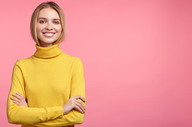 Blonde woman in turtleneck sweater