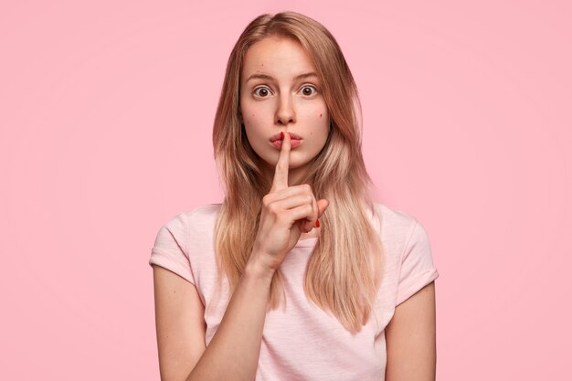 Blonde woman wearing pink T-shirt