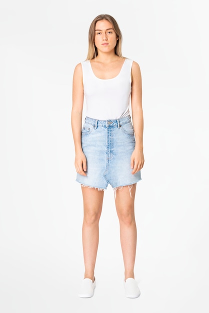 Free photo blonde woman in white tank top and denim mini skirt casual wear fashion full body