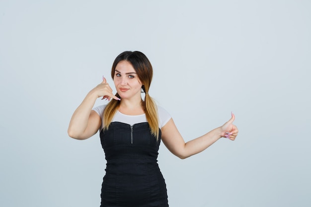 Blonde young lady in dress gesturing isolated