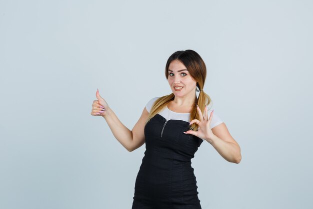 Blonde young lady in dress gesturing isolated