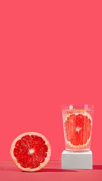 Free Photo blood orange half and juice arrangement