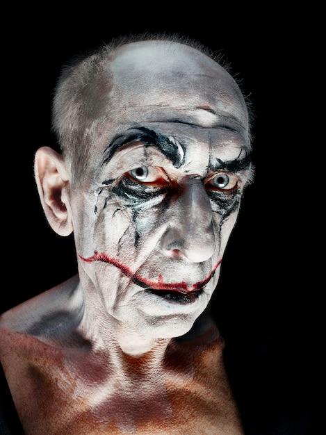 Free Photo bloody halloween theme: the crazy maniak face on dark studio